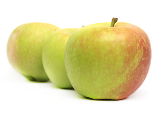 row of three apples