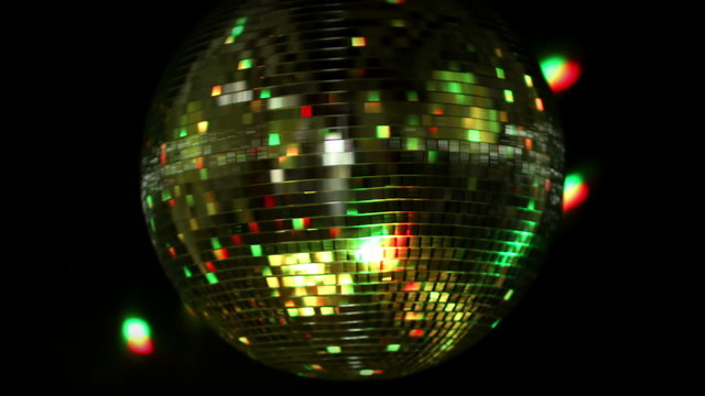 abstract funky discoball spinning with light effects and rays