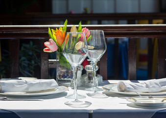 Table setting exterior restaurant in sunshine