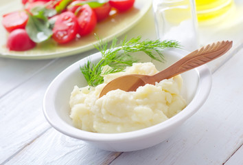Mushed potato in the white bowl