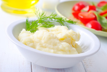 Mushed potato in the white bowl