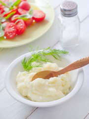 Mushed potato in the white bowl