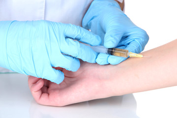vaccine injection in hand isolated on white