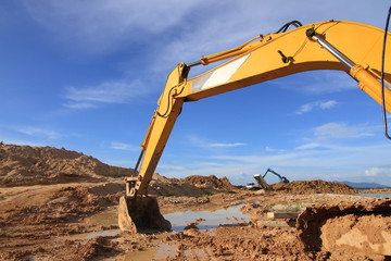 excavator loader machine during earthmoving works outdoors at co