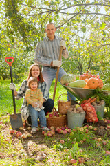 Happy  family with vegetables harvest