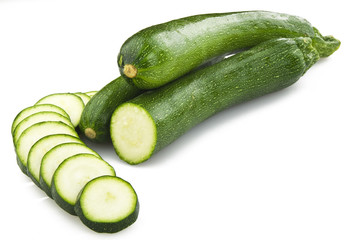 Fresh zucchini sliced close up on the white