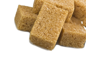  brown lump cane sugar cubes close up