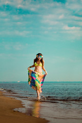 Luxurious beautiful fashionable woman on the beach