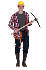 Smiling  workman with pickaxe