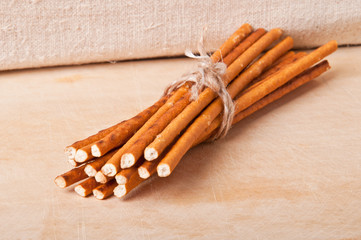 baked sticks on wooden background