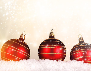 Red christmas balls on snow