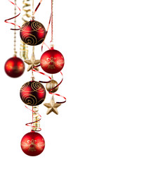 Bright red Christmas tree balls with curly ribbons isolated on t