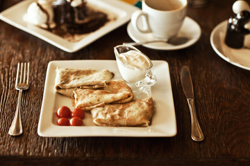 appetizing pancakes with sauce