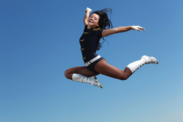 Young female dancer against white background