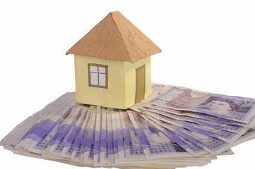 House and stack of money