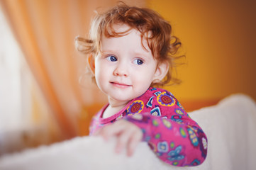 The baby in a red dress