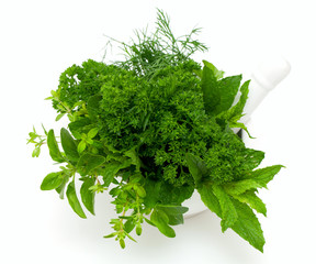 mortar with fresh herbs