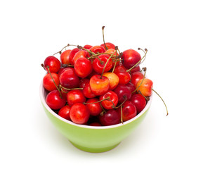 fresh cherries in a green bowl