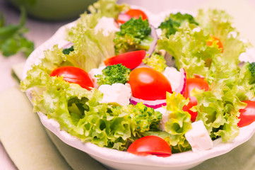 salad with tomatoes, broccoli, red onion and feta cheese