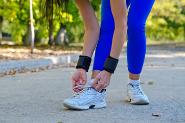 Athlete tying her laces