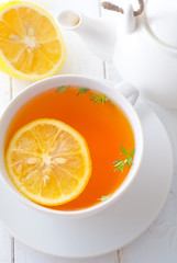 Fresh tea with lemon in the white cup