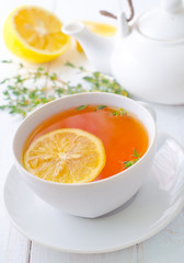 Fresh tea with lemon in the white cup