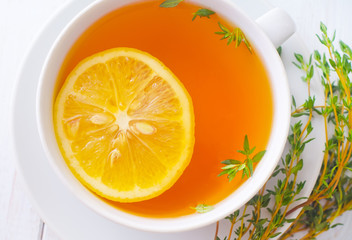 Fresh tea with lemon in the white cup