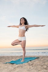 Fototapeta na wymiar Beach Yoga Woman