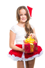 girl with red Christmas cap and present on isolated white