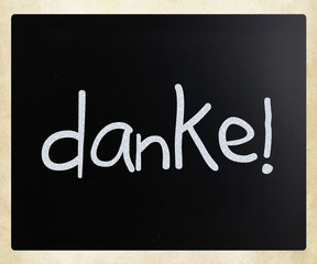 "Danke!" handwritten with white chalk on a blackboard