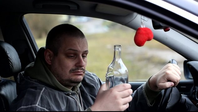 Depressed man to drinking alcohol in car