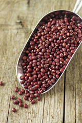 Raw red beans in a metal scoop