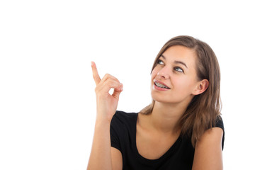 Closeup portrait of attractive happy young woman pointing at cop