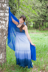 beautiful woman on nature near a birch