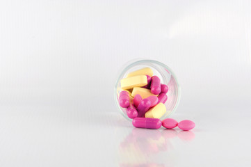 Medicine tablet in dosage glass