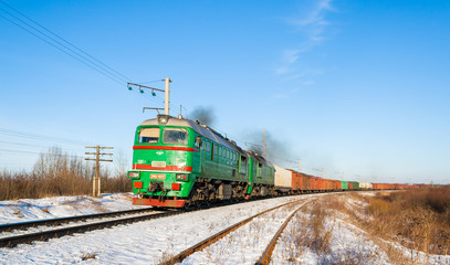 Freight train hauled by diesel locomotive. Ukrainian railways