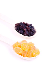 raisin and dried pineapple in a wooden spoon