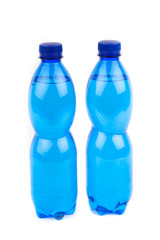 Plastic bottles of drinking water isolated on white