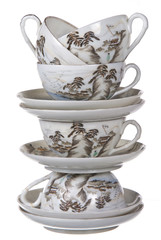 porcelain cups and plates stacked together on white background - 46691288