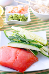 ingredients for sushi, sakmon and cucumber