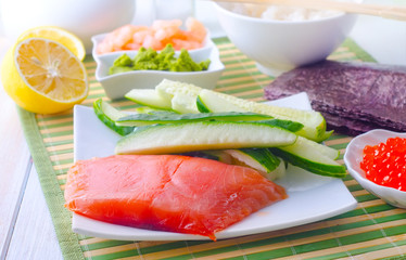 ingredients for sushi, sakmon and cucumber