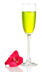 glass with cocktail and gladiolus bud isolated on white