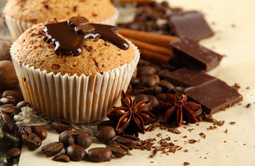 tasty muffin cakes with chocolate, spices and coffee seeds,