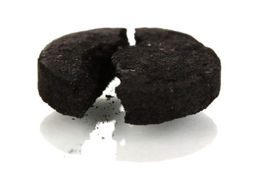 activated carbon in tablet isolated on white