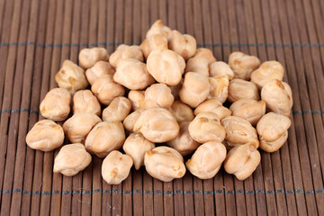 White chickpeas on color background