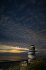 Pebble sculpture on a beach.
