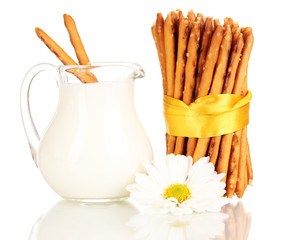Tasty crispy sticks with pitcher with sour cream isolated