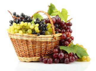 assortment of ripe sweet grapes in basket, isolated on white.