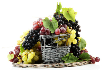 assortment of ripe sweet grapes in basket, isolated on white.