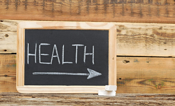 "health" word on blackboard with arrow